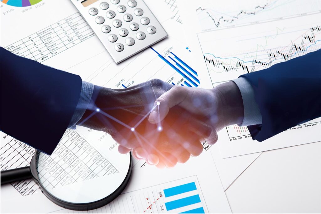 Business mens hands shaking against a background showing payroll service and HR charts